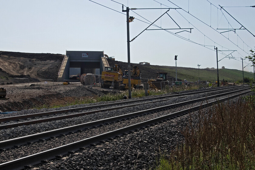 Northern portal, entry to Sergo Logistics Park, Milton Malsor 
 When the Sergo Logistics Park opens to rail traffic I am not sure as to what it will become known as in railway circles. Whatever it will be know as this is where trains will arrive and depart from the northern end. The Northampton to Hanslope Junction slow lines are in the foreground near the village of Milton Malsor. After a week of the slow lines being closed, I was expecting to see the lines emanating from under the bridge and the pointwork installed connecting them to the network; alas not at this end anyway! 
 Keywords: Northern portal entry to Sergo Logistics Park Milton Malsor