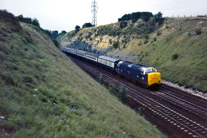 55003, 16.30 Hull-London King's Cross (1A28), Little Ponton SK939330 
 We could hear 55003 'Meld' thrashing away from Grantham climbing the northern flank of Stoke bank for some time before it entered the cutting here at Little Ponton. By the time it reached us here, leading the 1A28 16.30 Hull to King's Cross, it was going well with just over one hundred miles to go to its destination. 'Meld' looks smart with its white cab surrounds indicating that it was a Finsbury Park Deltic. 
 Keywords: 55003 16.30 Hull-London King's Cross 1A28 Little Ponton SK93933