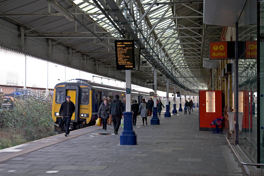 156452, NT 13.03 Manchester VIctoria-Clitheroe (2N52), Bolton station 
 A busy scene at Bolton station as 156452 waits at platform one with the 13.03 Manchester Victoria to Clitheroe working. Notice the ancient1970s BR era buffet sign still on the wall of the station building. 
 Keywords: 156452 13.03 Manchester VIctoria-Clitheroe 2N52 Bolton station