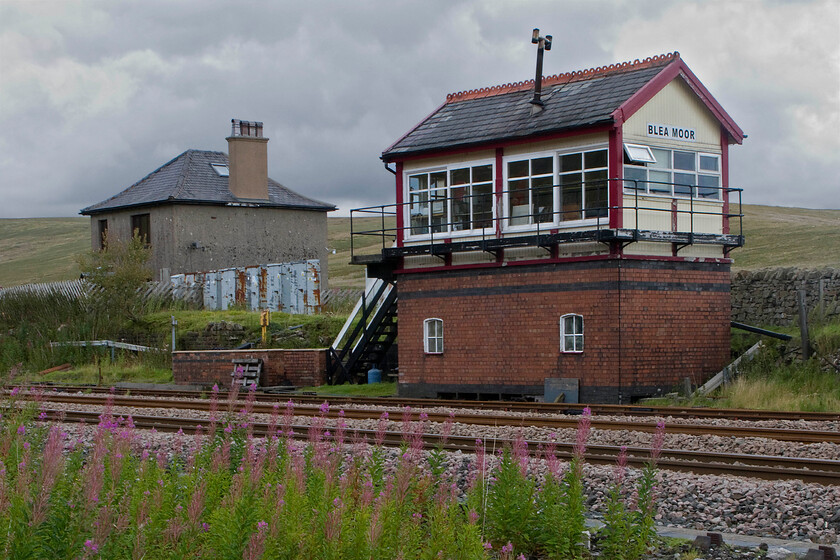 Blea Moor signal box (LMS, 1941) 
 On arrival at Ribblehead, I left Andy behind in an effort to get to Blea Moor signal box. In anticipation of it being quite a trek, I had borrowed my son's mountain bike and folded it up in the back of Andy's Nissan Micra using it to pedal as far as I could to the location of the box high up on the fells. The 1941 LMS box is incredibly remote with no road access with a very rough track that doubles as a footpath leading past the rear of the box. I took a less direct route as I needed a view from the front that involved some 'off-piste' cycling followed by some scrambling! The box has an interesting history that is documented, along with details on its operations, in a series of SRS videos on their website at...... https://www.s-r-s.org.uk/videoPages/BleaMoor.php 
 Keywords: Blea Moor signal box LMS