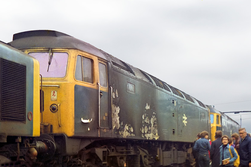 40176, 47510 & 47378, undergoing overhaul, Crewe Works 
 47510 is at the works for repair having sustained fire damage whilst hauling a freight on 02.09.77. It was repaired and later was named 'Fair Rosamund' before it was renumbered 47710. Unfortunately it caught fire again in July 1988. This time, it was not so lucky as this incident precipitated its withdrawl. Some of its components lived on to enable 47497 to be rebuilt into 47717. 47378 had a pretty anonymous life as no heat example and never being named. The nose of 40176 pokes itself in on the left.