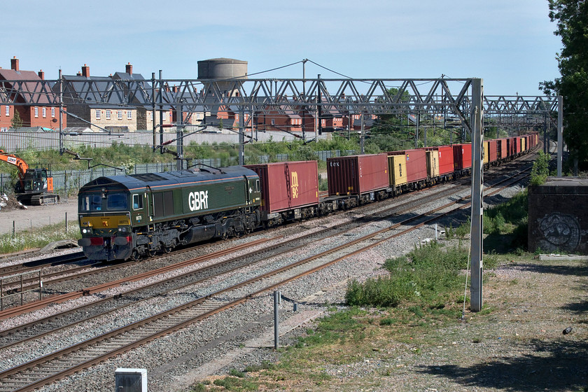 66779, 12.05 London Gateway-Hams Hall (4M46, 8L), site of Roade station 
 This is my first photograph of celebrity 'Shed' 66779 'Evening Star'. This has been the only livery carried by this locomotive since its arrival on UK soil in February 2016 with it being named some three months later. GBRf certainly seem to take great care to look after the paintwork with it looking superb in the afternoon sunshine working the 12.05 London Gateway to Hams Hall Freightliner passing Roade. Thanks to the driver for the toot on the horn and the friendly wave as he passed. 
 Keywords: 66779 12.05 London Gateway-Hams Hall 4M46 site of Roade station Evening Star