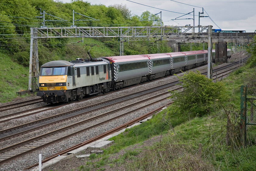 90044, LM 16.50 London Euston-Northampton Footex (1T16), Roade 
 The dream is over - for this season anyway! Northampton Town supporters will be on board drowning their sorrows as their team will not be joining League One next season having been beaten 3-0 by Bradford City. At least they will be enjoying travelling on a 'proper' train chartered by London Midland. The Virgin Pretendolino set is being hauled by 90044 which left Euston at 16.50 heading to Northampton. The train is seen approaching Roade 
 Keywords: 90044 16.50 London Euston-Northampton Footex 1T16 Roade Pretendolino