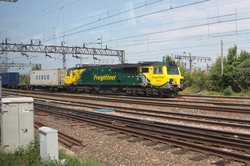 70009, 05.20 Trafford Park-Felixstowe North (4L97), Willesden North Junction 
 Our train passes the 05.20 Trafford Park to Felixstowe North Freightliner at Willesden North Junction. 70009 looks smart in its Freightliner livery as it leads the train that will soon diverge from the WCML and take the North London Line to Stratford. 
 Keywords: 70009 05.20 Trafford Park-Felixstowe North 4L97 Willesden North Junction