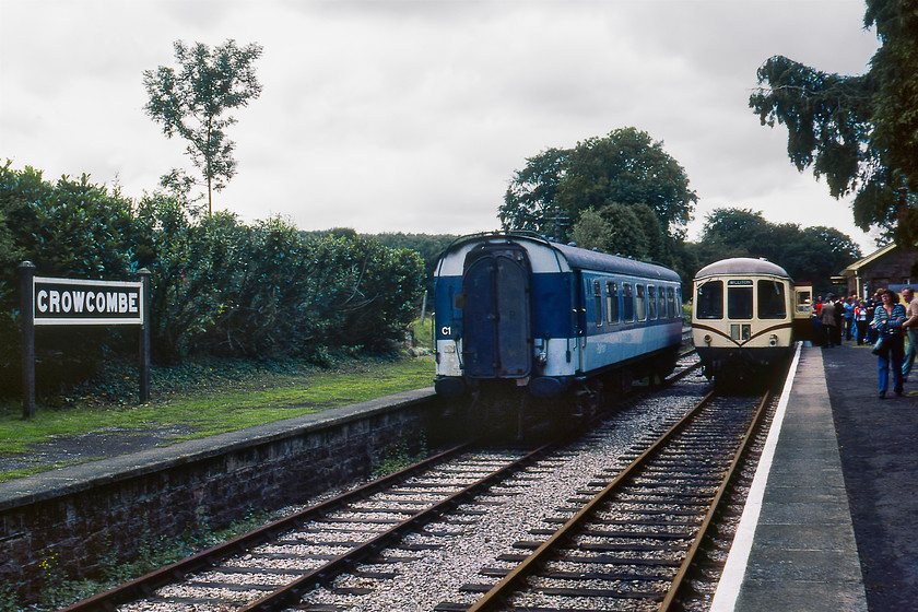 Class 103 DMU, W56169 & W50414, 12.30 Minehead-Crowcombe & ex Pullman E329 Crowcombe station 
 The crowds alight on Crowcombe station from the terminating 12.30 service from Minehead. The train has been worked by a two-car Park Royal DMU made up of M56169 and M50414 that I had travelled on from Watchet. Sitting on the adjacent platform here at Crowcombe is former BR Pullman First class parlour car number E329. This Metro-Cammell coach was built in 1962 and arrived on the WSM a year prior to this photograph being taken in 1979 staying until 1983. I am not sure of it whereabouts now or even if it still exists; advice anybody?

There is an audio recording of this event on my youtube channel, see..https://youtu.be/eCT7OtEH7mc 
 Keywords: Class 103 DMU W56169 W50414 12.30 Minehead-Crowcombe & ex Pullman E329 Crowcombe station WSR West Somerset Railway