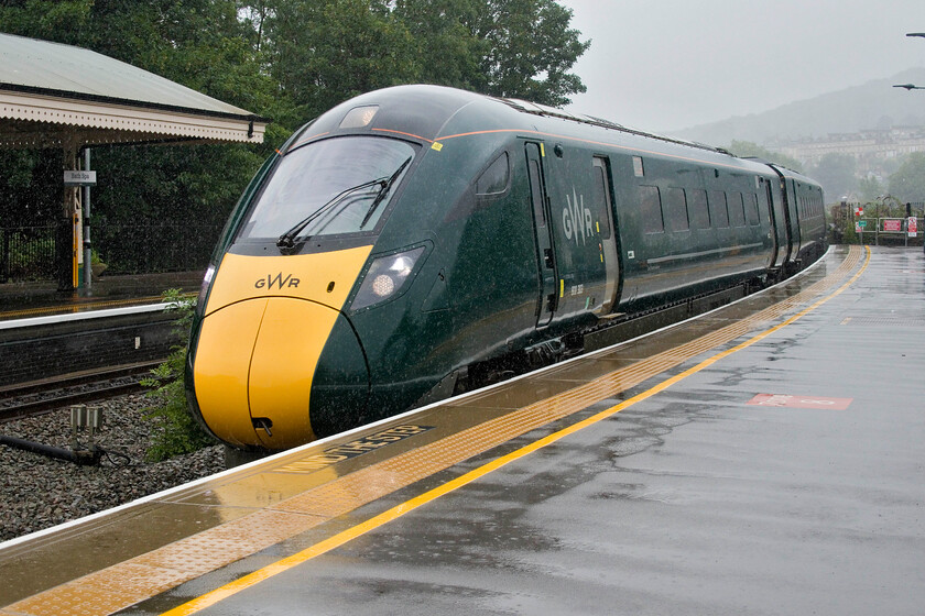 800303, GW 13.28 London Paddington-Bristol Temple Meads, (1C16, RT), Bath Spa station 
 Yes, and still it pours with rain! 800303 arrives at a sodden Bath Spa working the 13.28 Paddington to Bristol train. Andy and I took this train back to Temple Meads having the coach towards the rear of the train almost to ourselves. This short journey reminded me how uncomfortable and austere the interior of these trains is. Yes, the coaches ride well and it is extremely quiet but my posterior feels somewhat differently! 
 Keywords: 800303 13.28 London Paddington-Bristol Temple Meads, 1C16 Bath Spa station GWR IET