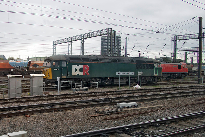 56303 & 90036, stabled, Wembley Yard 
 56303 has been in this position in Wembley Yard for sometime now. At the time of writing, I am not quite sure why and what the future holds? Behind it, 90036 'Driver Jack Mills' awaits its next duty. This locomotive has been doing a lot of work on the ECML standing for various 91s that have been having recent reliability issues. 
 Keywords: 56303 90036 stabled Wembley Yard