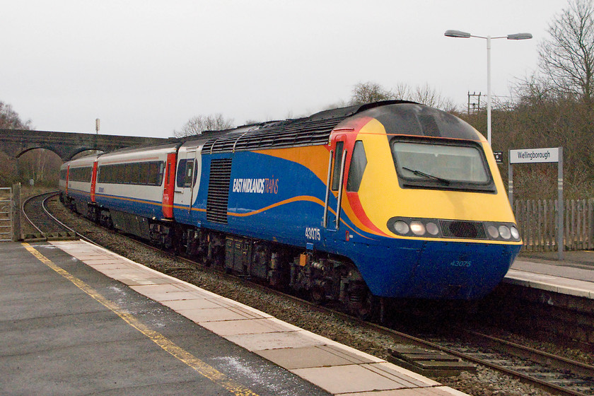 43075, EM 10.32 Nottingham-London St. Pancras (1B33), Wellingborough station 
 The old order is still operational at Wellingborough as 43075 passes through leading the 10.32 Nottingham to St. Pancras HST working. 43075 was an Eastern Region power car delivered during early 1976 as part of set 254010. This set did not enter service on the ECML until 1977 and, along with its classmates, precipitated the withdrawal of the Deltics. 
 Keywords: 43075 10.32 Nottingham-London St. Pancras 1B33 Wellingborough station