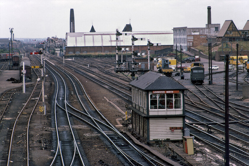 Leicester North signal box (MR, 1911) 
 Using my 135mm zoom lens has enabled this detailed view of the trackwork and signalling to the north of Leicester station to be brought together. The crowded and extensive nature of the infrastructure then is in marked contrast to today with a basic track layout and the absence of all of the Victorian-age signalling. The only real growth is that UKRL depot has taken over the former PW sidings to the extreme right and has developed their depot and maintenance facility, see.... https://www.ontheupfast.com/p/21936chg/30024705465/x56081-56312-56104-47843-stabled The 1911 Midland signal box closed in 1985 when the whole area was resignalled with the opening of the Leicester PSB. Notice the unusually designed pair of structures to the extreme top right that also feature in my 2022 image. Until recently they were the home to the Leicester International School which has now closed following a disastrous Ofsted report in 2017. 
 Keywords: Leicester North signal box MR Midland Railway