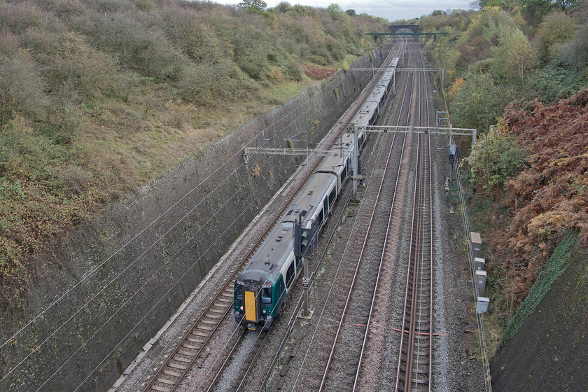 350253 & 350117, LN 12.25 London Euston-Northampton (2Z25, 4E), Roade cutting 
 A wide-angled view of Roade cutting looking south taken from Accommodation or Thorpe Wood bridge (whichever name you choose!). 350253 and 350117 are seen working the 12.25 Euston to Northampton 2Z25 service. This was just one of the services running as part of London Northwestern's emergency timetable hastily put together due to severe staff shortages, a day that finished off a disastrous week for the operator, see.... https://www.bbc.co.uk/news/uk-england-50262788 
 Keywords: 350253 350117 12.25 London Euston-Northampton 2Z25 Roade cutting