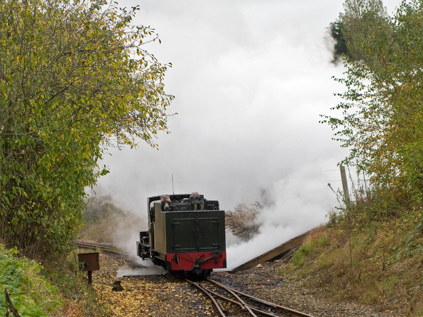 7, running round, Wroxham station 
 Filling the cutting with steam blowing off from the safety valves number 7 'Spitfire' runs around having been turned on Wroxham's turntable. It is a feature of all of the Bure Valley Railway workings that locomotives always operate boiler first as turntables are located at both ends of the line. Number 7 was named in 1997 in recognition of the role played by the Spitfire which flew from many local bases during World War II. 
 Keywords: 7 Wroxham station Spitfire Bure Valley Railway