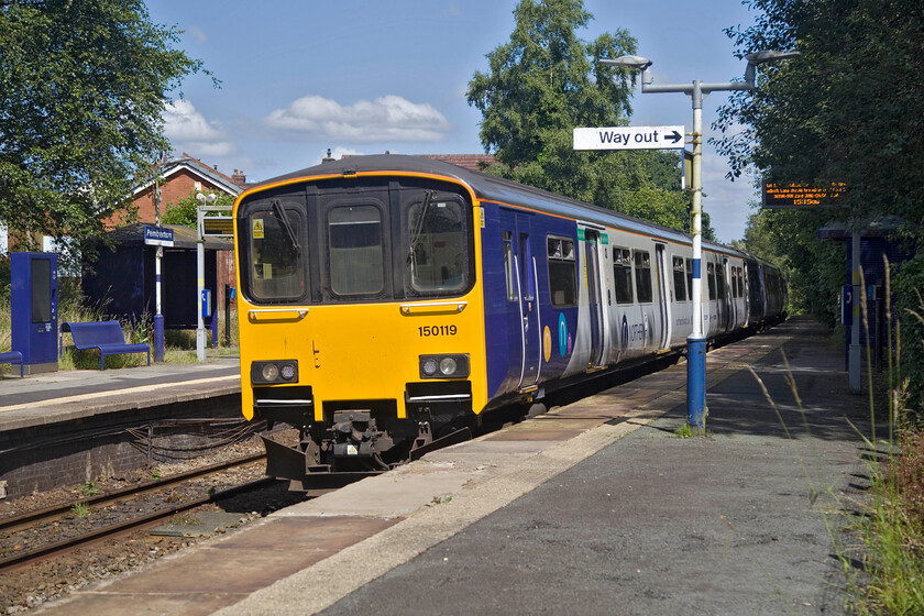 150119 & 156405, NT 13.20 Blackburn-Headbolt Lane (2K69, 3E), Pemberton station 
 150119 & 156405 come to a halt at Pemberton station working the 13.20 Blackburn to Headbold Lane service. The opening of the Merseyrail interchange station in the autumn of last year will hopefully encourage more passengers to use this line helped even more in the future once new stock arrives and possible electrification. 
 Keywords: 150119 156405 13.20 Blackburn-Headbolt Lane 2K69 Pemberton station Northern