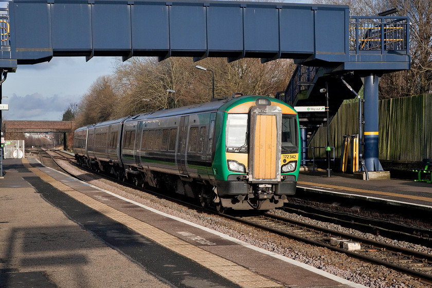 172342, LN 13.46 Dorridge-Worcester Shrub Hill (2V32, 2E), Langley Green station 
 With the late afternoon sun reflecting awkwardly off the windscreen of 172342 as it arrives at Langley Green station. It was forming the 13.46 Dorridge to Worcester Shrub Hill working. Langley Green station was originally opened by the GWR in 1846. 
 Keywords: 172342 2V32 Langley Green station.