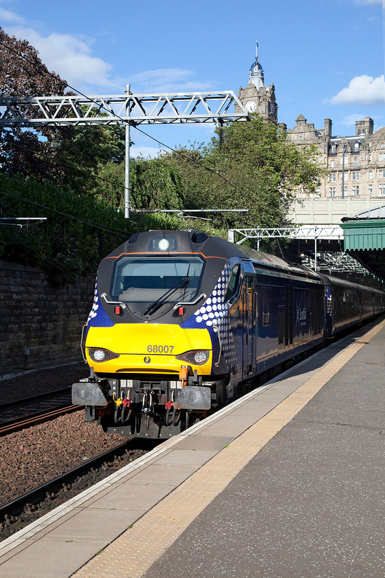 68007, SR 17.20 Edinburgh Waverley-Cardenden (2L69), Edinburgh Waverley station 
 68007 'Valiant' leaves Waverley station with former North British Hotel dominating the skyline. According to the clock on the hotel and the time marker on the camera, it left a little late with the 2L69 17.20 Cardenden evening commuter train. 
 Keywords: 68007 17.20 Edinburgh Waverley-Cardenden 2L69 Edinburgh Waverley station