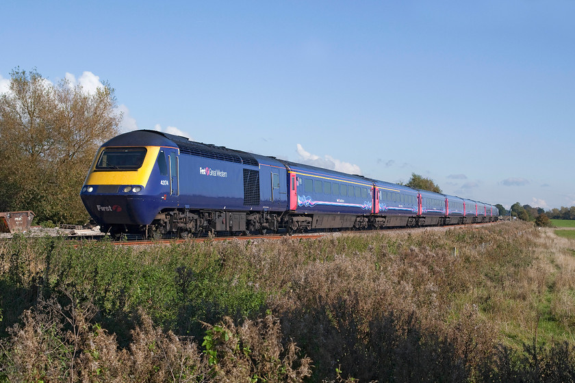 43174, GW 11.36 London Paddington-Cheltenham (1G29), Ashbury Crossing SU246878 
 43174 leads the 11.36 Paddington to Cheltenham Spa past Asbury crossing just south of Shrivenham. I have always admired how FGW have maintained their stock and power cars keeping them smart despite them coming up for forty year's old! Having said this, 43174 was a later power car being introduced for the north east/south west route in the summer of 1982. 
 Keywords: 43174 11.36 London Paddington-Cheltenham 1G29 Ashbury Crossing SU246878