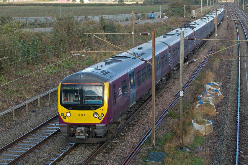 360111 & 360118, EM 10.10 Corby-London St. Pancras (1H20, 4L), Park Road bridge TL020390 
 With the sun having dived behind a fast-moving cloud seconds before the 10.10 Corby to St. Pancras service passes Park Road bridge worked by 360111 and 360118 the lighting is not as good as it could be. This location is a quiet one in the Bedfordshire countryside just north of the Ampthill tunnels with the only interruptions, apart from the trains, being the odd dog walker and farm vehicle. 
 Keywords: 360111 360118, EM 10.10 Corby-London St. Pancras 1H20 Park Road bridge TL020390