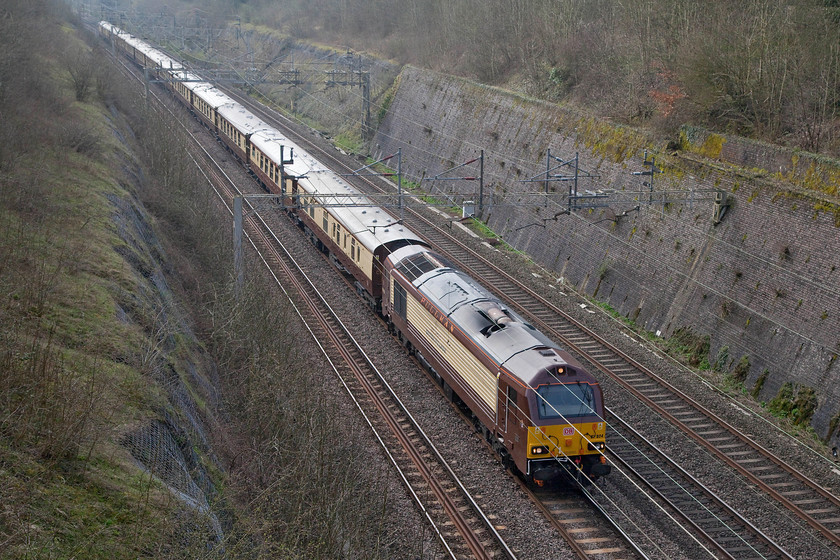 67024, 08.14 London Victoria-Runcorn (1Z48), Roade Cutting 
 The second of the Grand National specials passing through Roade Cutting is largely composed of the Belmond Pullman stock hauled by deidcated 67024. It was the 08.14 from London Victoria to Runcorn with a transfer to Aintree from there. 
 Keywords: 67024 08.14 London Victoria-Runcorn 1Z48 Roade Cutting