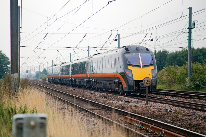 180107, GC 06.55-Bradford Interchange-London Kings Cross (1A59, RT), Biggleswade TL192433 
 180107 'Hart of the North' is likely to be doing 125mph on this section of track as it heads south working the 06.55 Bradford Interchange to London King's Cross. The location is Smarts foot crossing just south of the A1 overbridge at Biggleswade. 
 Keywords: 180107 1A59 Biggleswade TL192433