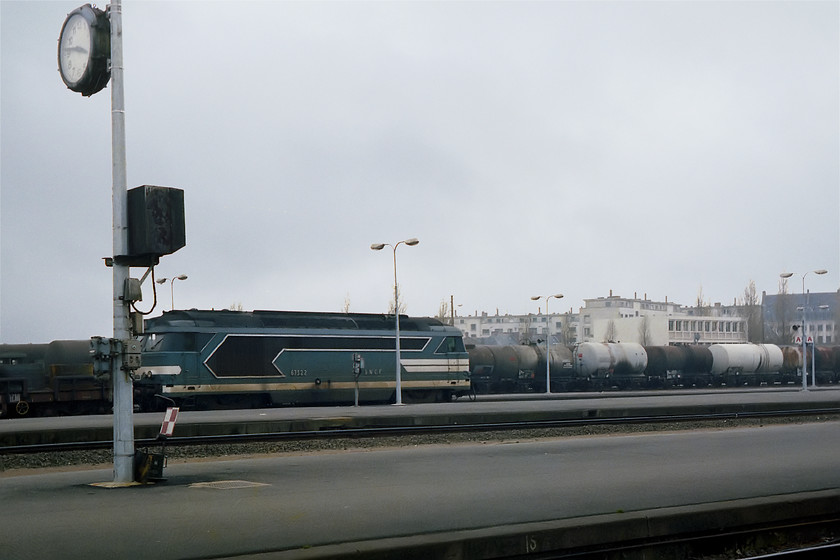 67322, freight train, Nantes 
 A BB class number 67322 eases a freight into Nantes station from the east. This view shows some of the area south of the station that looked to a particularly run-down part of the city. Looking at it today, it appears to have been completely re-developed with a proliferation of flats, restaurants, sporting facilities and tree lined boulevards all down by the river. 
 Keywords: 67322 freight train Nantes