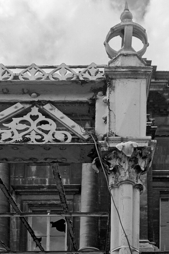 Frontage & canopy, Bath Green Park station 
 The wrought iron canopy at the front of Bath's Green Park station is devoid of its glazing and awaiting some much-needed attention but it still looks elegant and in keeping with the station building to which is affixed. Thankfully, restoration was not far away as the whole site had recently been acquired by Sainsbury's and they were to spend a fortune restoring the former Midland/Somerset and Dorset Joint station and its environs. This whole process took two years with the station being reopened again in 1983. 
 Keywords: Frontage canopy Bath Green Park station