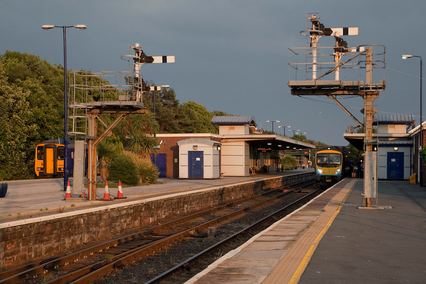 156443, NT 20.20 Barrow-in-Furness-Carlisle (2C51, 4L) & 185127, NT 17.42 Manchester Airport-Barrow-in-Furness (1C54, 3L), Barrow-in-Furness station 
 After a quick shower and a change of clothes Andy and I headed into 'downtown' Barrow-in-Furness in search of a curry house! Before commencing our search, we called in at Barrow station and were greeted with some amazing evening light. To the left, 156443 is about to leave with the 20.20 to Carlisle. Whilst on the right, 185127 has just arrived with the terminating 17.42 from Manchester Airport. Barrow retains some superb semaphores all controlled by the signal box on the platform end. 
 Keywords: 156443 2C51 185127 1C54 Barrow-in-Furness station