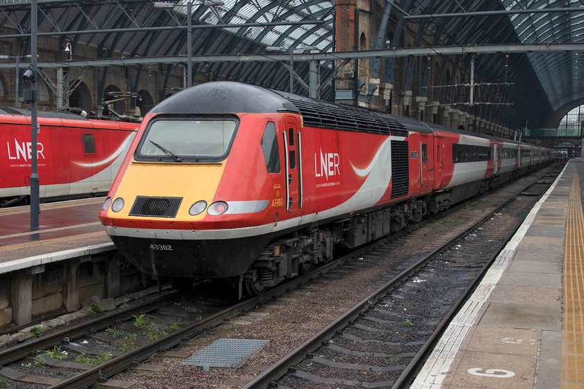 43302, GR 15.30 London King`s Cross-Edinburgh (1S23, 3L), London King`s Cross station 
 Standing under the grandeur of one of King's Cross' station arches 43302 waits to leave with the 15.30 to Edinburgh. I hope that the passengers aboard appreciate the comfort of the Mk. III coaches with their soft seating as their ride will become a lot harder next month when the Azumas are introduced with their infamous seats! 
 Keywords: 43302 15.30 London King`s Cross-Edinburgh 1S23 London King`s Cross station