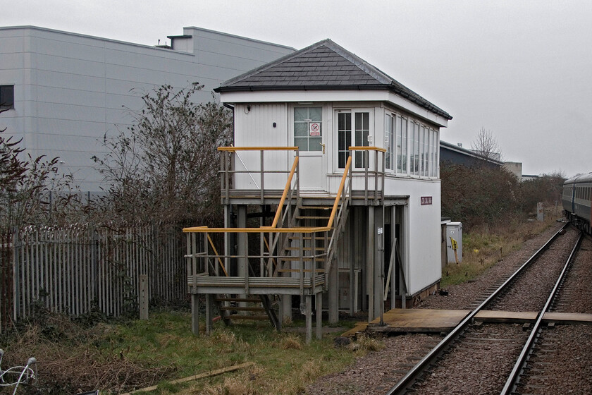 Acton Canal Wharf signal box (Mid, 1894) 
 It is hard to believe that the signal box seen here.... https://www.ontheupfast.com/p/21936chg/27444280004/acton-canal-wharf-signal-box-tq211829 is one and the same! The old Midland box, which dated from 1894, is completely encased within the new and much larger UPVC creation. However, I should not moan as it is pretty astounding that this small section of absolute block working that is controlled by three mechanical boxes is still in operation deep within London! It is seen here from the window of the Verney Venturer charter that had reversed just south of the box and that is seen crossing over a little further ahead. 
 Keywords: Acton Canal Wharf signal box Midland 1894