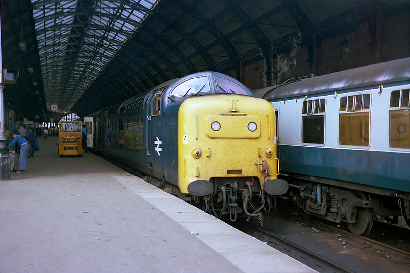 55016, 09.00 Aberdeen-London KingsCross (1E11), Darlington station 
 55016 'Gordon Highlander' pauses at Darlington with the 09.00 Aberdeen to King's Cross working. As the driver peers back down his train he is probably hoping that the worker loading the mailbags gets a move on so that the train can get under way as quickly as possible. I like the reflection of the Deltic in the windows of the rake of Mk. I stock stabled on the adjacent track. 
 Keywords: 55016 09.00 Aberdeen-London KingsCross 1E11Darlington station