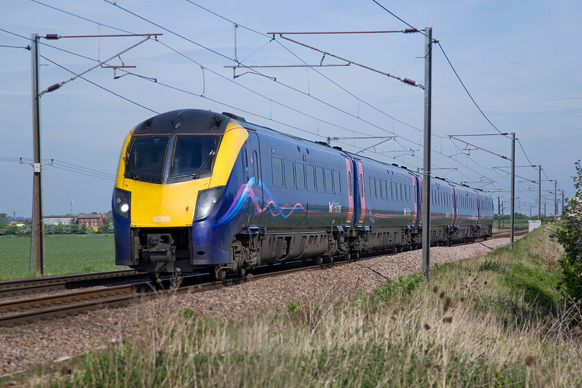 180109, HT 08.25 Hull-London King's Cross (1A92), Frinkley Lane crossing SK906436 
 Hull Trains' 180109 roars south working the 08.25 Hull to King's Cross service. The Cummins QSK19 engines (one per coach) use Voith Hydraulic transmission to provide power to the wheels in the best traditions of British Railways Western Region's early forrays into dieselisation; something as a West Country lad that I fully appreciate! 
 Keywords: 180109 08.25 Hull-London King's Cross 1A92 Frinkley Lane crossing SK906436 Hull Trains