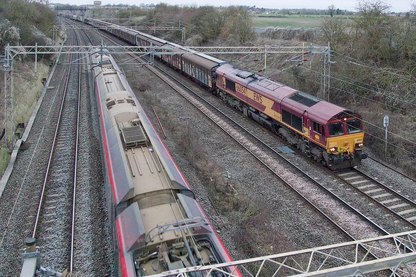 390135, VT 14.30 Birmingham New Street-London Euston (1B56, 2L), & 66054, 14.47 DIRFT-Dollands Moor (6M45), Victoria bridge 
 And so to the final picture of 2018. 390135 'City of Lancaster' passes Victoria Bridge near to Roade on Northamponshire forming the 14.30 Birmingham New Street to Euston. Meanwhile, 66054 leads the seven-day-a-week 6M45 14.47 Daventry Railfreight Terminal to Dollands Moor empty vans. That's it for 2018 and an interesting one it's been, I wonder what 2019 will bring? 
 Keywords: 390135 14.30 Birmingham New Street-London Euston 1B56 66054 14.47 DIRFT-Dollands Moor 6M45 Victoria bridge