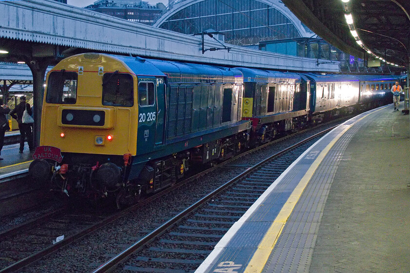 20205 & 20007, outward leg of The Shakespearean Sonnet, 07.01 London Paddington-Long Marston (1Z58, RT), London Paddington station 
 A scene not often witnessed at London Paddington! 20205 and 20007 stand at the country end of the station waiting to leave with the 1Z58 07.01 Shakespearean Sonnet charter that would, ultimately, end up at Stratford-on-Avon via runs along the freight only spurs to Long Marston and Fenny Compton M.O.D. The bright light reflected on the side of the generator coach is from a Heathrow Express class 387 that almost spoiled the party by departing almost at the same time as the charter! 
 Keywords: 20205 20007 outward leg of The Shakespearean Sonnet 07.01 London Paddington-Long Marston 1Z58 London Paddington station Chopper