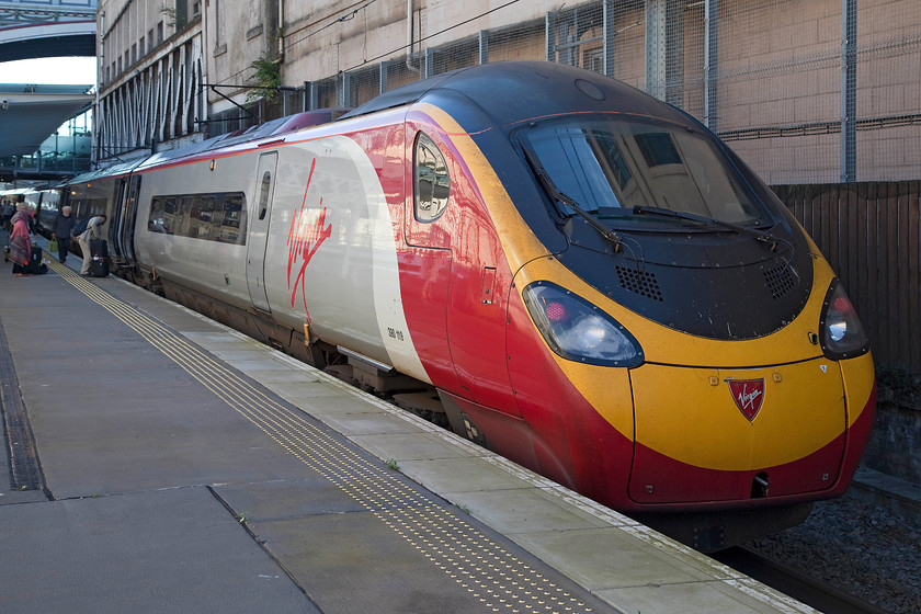 390119, VT 10.51 Edinburgh Waverley-London Euston (9M54), Edinburgh Waverley station 
 Our train home stands at Edinburgh's platform nine. We travelled all the way back to Milton Keynes on 390119 'Virgin Warrior' as the 10.51 Edinburgh to Euston 9M54 service. Whilst I am not a huge fan of the Pendolinos, they are infinitely better than their Voyager cousins despite their stinking waste tanks. 
 Keywords: 390119 10.51 Edinburgh Waverley-London Euston 9M54 Edinburgh Waverley station