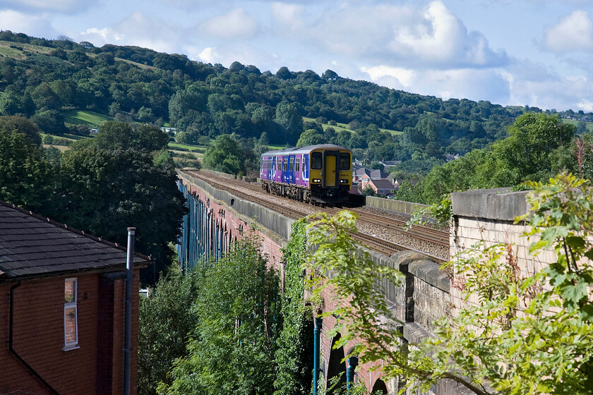 150214, NT 09.03 Manchester Victoria-Clitheroe (2N57), Whalley viaduct 
 The forty eight arch Whalley viaduct was took four years to build being completed in 1850. At just over half a kilometre long it remains the largest viaduct in Lancashire carrying the former Lancashire and Yorkshire line between Blackburn and Hellifield across the Calder Valley. In this view taken from the end of Whalley station 150214 approaches the station working the 2N57 09.03 Manchester Victoria to Clitheroe service. 
 Keywords: 150214 09.03 Manchester Victoria-Clitheroe 2N57 Whalley viaduct Northern