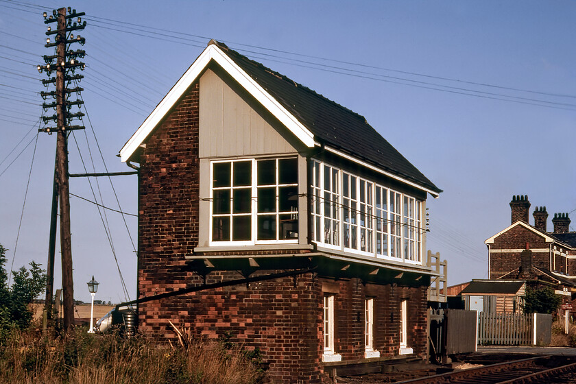 French Drove signal box (GN, 1882) 
 The lovely Great Eastern box at French Drove is seen waiting to signal its next train. However, being a Sunday there would be little traffic over the March to Spalding line that would close fifteen months after this photograph was taken. The box was located just north of a level crossing with the closed French Drove and Gedney station on the other side of the crossing. Like its neighbouring box at Murrow West this box still survives and is now a rather nice one-bedroomed house that has recently been on the market for 300,000 but it does have one-third of an acre of what would have been former railway land. By 2023 the box looks very different being totally surrounded by trees, see. https://www.ontheupfast.com/p/21936chg/30044473945/x11-former-french-drove-signal-box 
 Keywords: French Drove signal box GN Great Northern