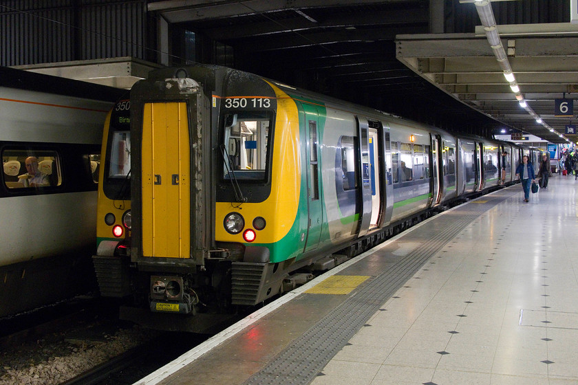 350113, LN 19.49 London Euston-Birmingham New Street (1Y79, 4L), London Euston station 
 Our train home from London to Northampton is seen waiting at Euston's platform six. 350113 will work the 19.49 to Birmingham New Street. Surprisingly, the train was not packed as it usually is. However, the toilets were out of use with an appalling stench emanating from around one of them that permeated throughout one of the coaches. Needless to say, we chose a pair of seats as far as possible from the toilet concerned. 
 Keywords: 350113 19.49 London Euston-Birmingham New Street 1Y79 London Euston station