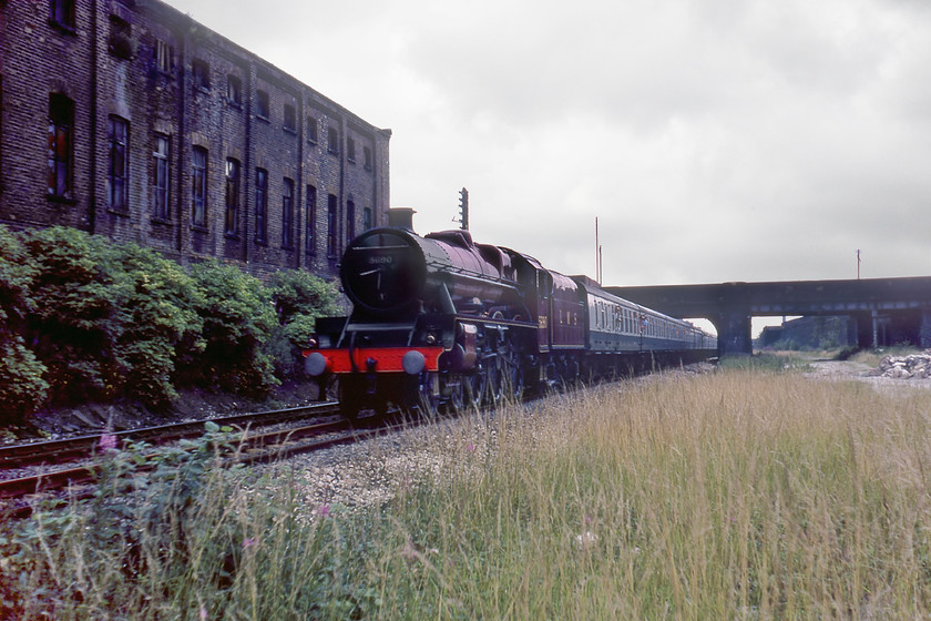 5690, return leg of BR sponsored Liverpool Edge Hill-Manchester Special, Salford SJ815981 
 Approaching the end of its foray out from and then back to Manchester ex LMS Jubilee 5690 'Leander' passes through Salford. It is leading a BR organised special as part of the 1980 Rocket 150 celebrations. This highly questionable trackside view is taken looking westwards from under Windsor Street bridge. The bridge in view here has now been demolished with the area covered by the large roundabout from where the M602 motorway starts that then follows the former trackbed seen to the right in this photograph westwards away from the city 
 Keywords: 5690 return leg of BR sponsored Liverpool Edge Hill-Manchester Special Salford SJ815981 LMS Leander 45690