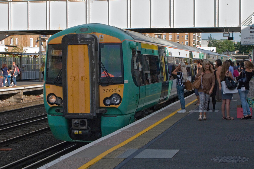 377205, SN 18.05 Clapham Junction-Watford Junction (18.26 Kensington Olympia-Watford Junction), Kensington Olympia station 
 The first of our two trains home from London to Northampton arrives at Kensington Olympia station. Along with many punters leaving the adjacent exhibition centre, we joined Southern's 387205 working the 18.05 Clapham Common to Watford Junction service. 
 Keywords: 377205 18.05 Clapham Junction-Watford Junction, Kensington Olympia station.jpg