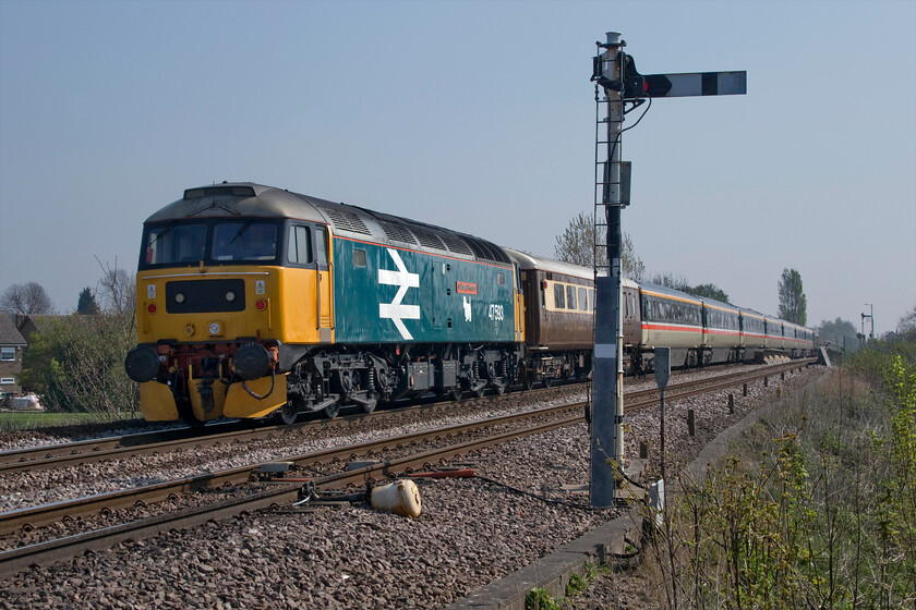 47593, outward leg of The Norfolk Coast Express, 06.19 Manchester Piccadilly-Great Yarmouth (1Z75 4L), Harts Drove crossing TL273962 
 Passing Harts Drove level crossing just west of Whittlesey 47593 'Galloway Princess' looks magnificent in its large logo BR blue livery complete with Scottie dog vinyl under the nameplate. It is bringing up the rear of the 1Z75 Norfolk Coast Express charter that had left Manchester at 06.19 heading for an afternoon by the seaside at Great Yarmouth. 
 Keywords: 47593 The Norfolk Coast Express, 06.19 Manchester Piccadilly-Great Yarmouth 1Z75 4L Harts Drove crossing TL273962 Whittlesey Galloway Princess