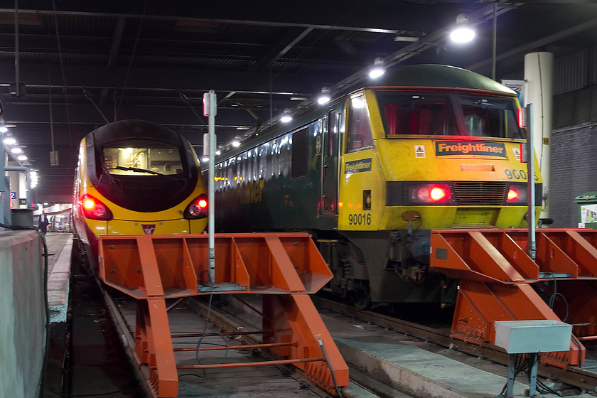 390125, VT 19.40 London Euston-Manchester Piccadilly (1H74, 4L) & 90016, CS 19.17 Wembley-London Euston sleeper ECS (5S95), London Euston station 
 390125 'Virgin Stagecoach' stands on the blocks at London Euston waiting to leave with the 1H74 19.40 service to Manchester Piccadilly. Next it is 90016 that has brought the 5S96 Caledonian Sleeper empty stock down from Wembley. This stock will then form the 'lowland' sleeper to Edinburgh and Aberdeen later in the evening. 
 Keywords: 390125 19.40 London Euston-Manchester Piccadilly 1H74 90016 19.17 Wembley-London Euston sleeper ECS 5S95 London Euston station