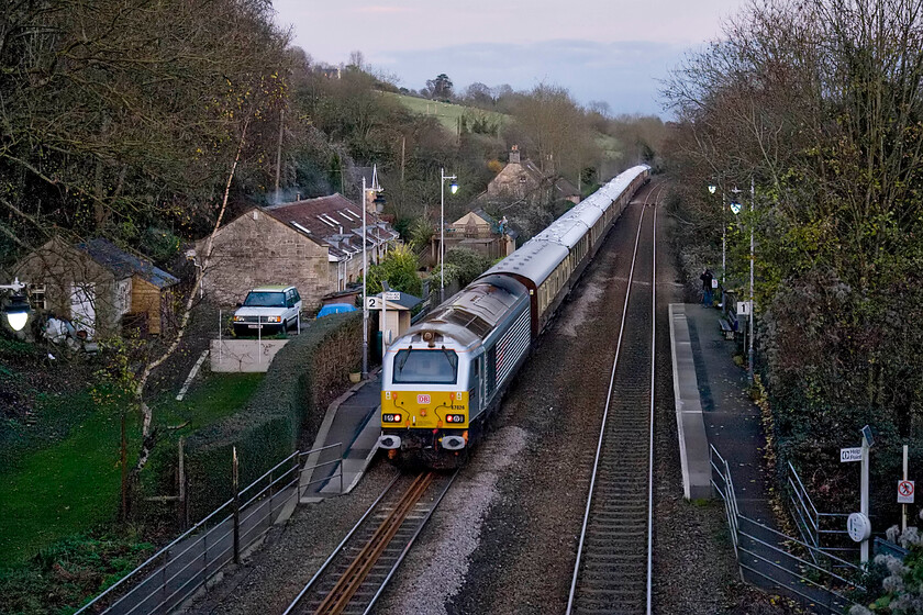 67026, return leg of VSOE excursion, 15.55 Bath Spa-London Victoria (1ZXX), Avoncliff station 
 67026 'Diamond Jubilee' brings up the rear of the returning VSOE 15.55 Bath Spa to Victoria charter that is seen passing the diminutive Avonlcliff halt in the Avon valley near Bradford-on-Avon. I am quite impressed with the way that camera has handled this very tricky image taken in what was in reality half-light at the very end of the day. There was a fair amount of digital noise to take care of but Photoshop with its excellent Neat Image add-on handled it well. If anybody can supply me with the complete head code for this charter it would be much appreciated. 
 Keywords: 67026 VSOE 15.55 Bath Spa-London Victoria 1ZXX Avoncliff station Diamond Jubilee