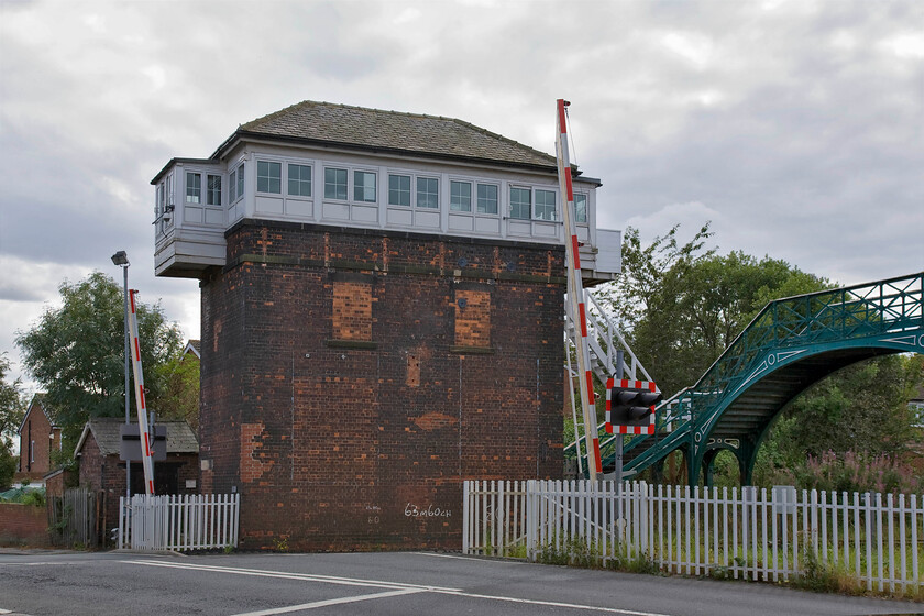 Billingham signal box (NE, 1904) 
 The North Eastern Railway characteristically constructed a number of tall signal boxes but Billinghams is an extreme example that would offer the signalman some commanding views across the gardens of the Teeside town! Built in 1904 it controls a number of semaphores, Billingham Junction where the branch to Haverton Hill diverges and the level crossing seen in this photograph. Unfortunately, like all boxes on the Durham Coast route, it is due for replacement over the coming few years with demolition likely due to the complex nature of maintaining such a grand structure. 
 Keywords: Billingham signal box North Eastern Railway