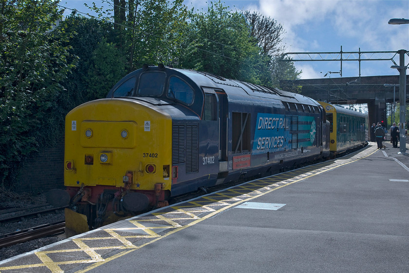 37402 & 975025 'Caroline', 07.25 Willesden-Willesden (via Cambridge & Ipswich), Witham station 
 On arrival at Witham station, Andy and I could hear the familiar tones of an English Electric engine at idle. We discovered 37402 'Stephen Middlemore 23.12.1954-8.6.2013' at the rear of the 07.25 Willesden to Willesden inspection train about to leave propelling saloon 'Caroline'. 
 Keywords: 37402 975025 Caroline 07.25 Willesden-Willesden via Cambridge & Ipswich Witham station Stephen Middlemore 23.12.1954 - 8.6.2013