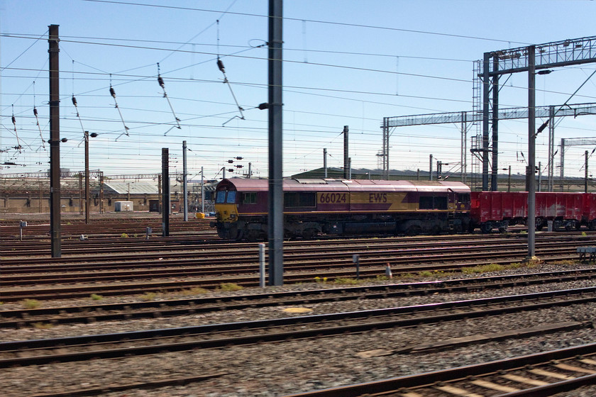 66 024, stabled, Wembley Yard 
 As we passed Wembley Yard, EWS livered 66024 was observed at the head of was probably a spoil train. 
 Keywords: 66 024 Wembley Yard