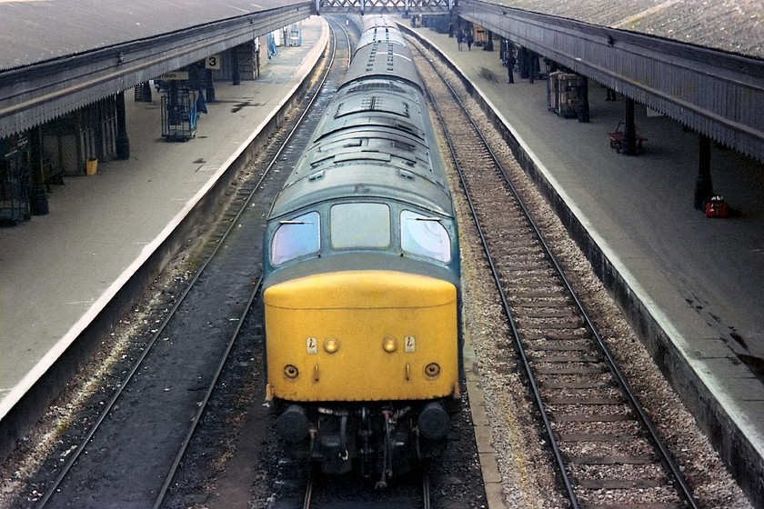 46021, unidentified down working, Exeter St 
 This is the only picture that I have a train passing Exeter St. David's on the centre relief line. It was pretty rare for trains not to stop at St. David's and to capture an express on an unidentified down working was an achievement for me! The picture is taken from a position on the station footbridge. Notice how quiet the platforms are, how often would St. David's look like this on a Saturday morning now? 
 Keywords: 46021 down working Exeter St.Davids station