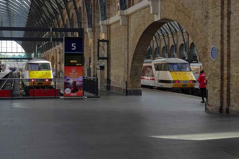 82215, GR 08.33 London King's Cross-Leeds (1D06, 1L) & 82212, GR08.03 London King's Cross-Leeds (1D05, 2L), London King's Cross station 
 Two LNER DVTs are nicely lit by the early morning sunshine penetrating the glasswork of King's Cross' roof. To the left 82215 will be at the rear of 08.33 1D06 service to Leeds. This will be not far behind the first down Leeds service that is just leaving with the 1D05 08.03 train. I hope that the passengers on board the superb Mk. IV coaches appreciate their superior comfort compared to the ironing boards that pass for seats on the Azumas (and most modern trains for that matter!). 
 Keywords: 82215 08.33 London King's Cross-Leeds 1D06 82212 08.03 London King's Cross-Leeds 1D05 London King's Cross station LNER DVT IC225