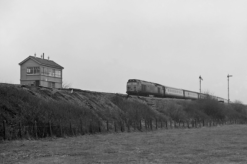 50029, 06.24 Penzance-London Paddington (1A15), Heywood Road Junction 
 50029 'Renown' is taking the sweeping curve from the Westbury cut-off as it passes Heywood Road Junction to the east of Westbury in Wiltshire. It is leading the 1A15 06.24 Penzance to Paddington Express. The wonderfully elevated and somewhat exposed 1933 built signal box is clearly seen. 50029 is still with us being one of a number of the class that is preserved, in this particular case by the 'Renown Repulse restoration Group'. 
 Keywords: 50029 06.24 Penzance-London Paddington 1A15 Heywood Road Junction