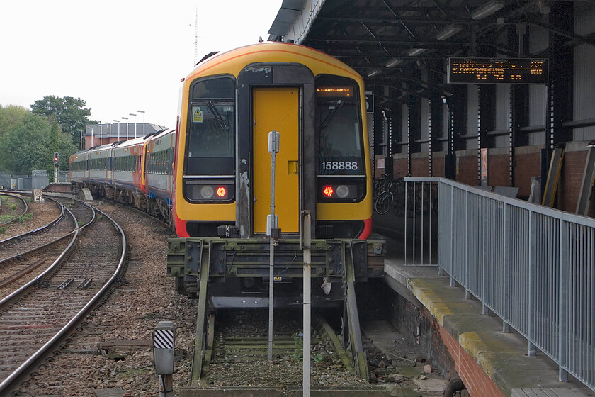 159105, SW 14.47 Salisbury-London Waterloo (1L50) & 158888, SW 14.56 Salisbury-Chandler's Ford (2R54), Salisbury station 
 Two SWT units stand at Salisbury platform six. Directly in front of the camera is 159105 will work the 14.47 service to London Waterloo. However, 159888 will first work the 2R54 14.56 stopper to Cahndler's Ford. I took a similar image during my 1981 visit to Salisbury with the signalling vying for interest as well as the motive power, see.... https://www.ontheupfast.com/p/21936chg/30035687496/x1130-stabled-salisbury-station-thumper 
 Keywords: 159105 14.47 Salisbury-London Waterloo 1L50 158888 14.56 Salisbury-Chandler's Ford 2R54 Salisbury station SWT South West Trains