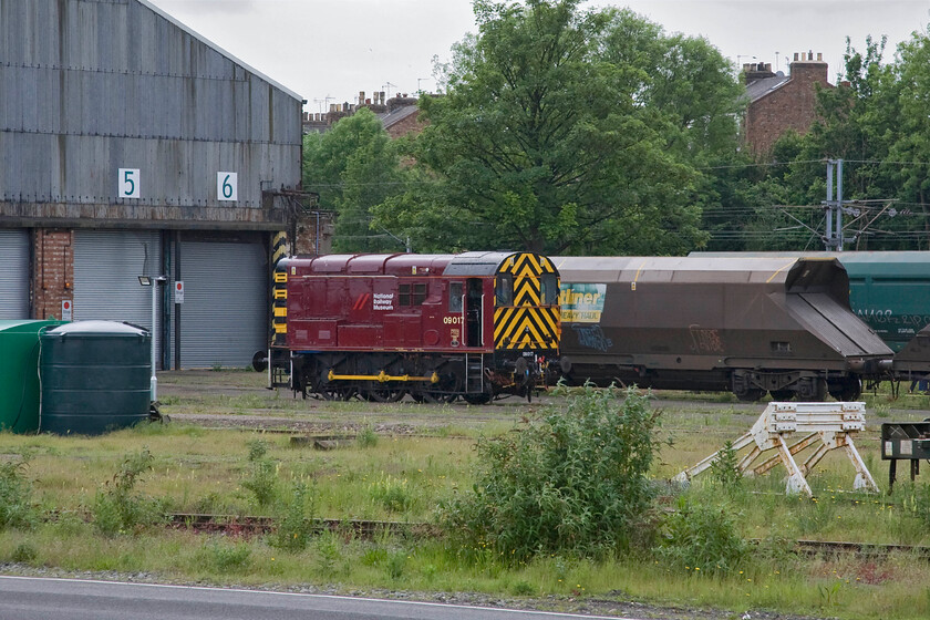 09017, Freightliner depot, York 
 Wearing its very smart NRM livery shunter 09017 sits outside the Freightliner wagon repair facility at the back of the NRM. It was built at Horwich works entering service with British Railways in November 1961 initially allocated to Chester (6A) before moving to the Southern Region ending up at Sellhusrt until withdrawal came in June 1998. It is now one of the NRM's resident shunters. 
 Keywords: 09017 Freightliner depot York