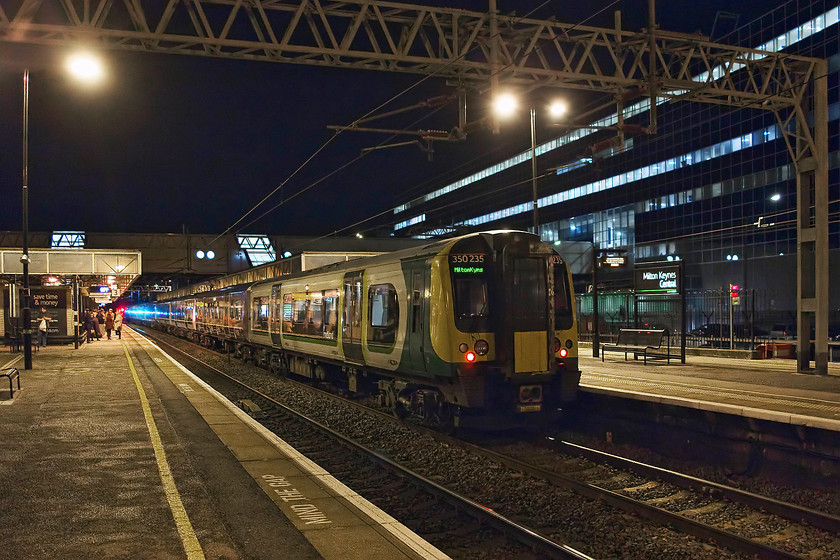 350235, class 350 & 350369, LM 18.54 London Euston-Milton Keynes Central (2K09, 66L), Milton Keynes central station 
 On arrival back at Euston trains were in complete disarray following the impact of Storm Dorris. Basically, we decided to take the next train north that we could find. The first was the 18.54 to Milton Keynes that we figured would at least get us there. The onward journey to Northampton we would worry about on our arrival be it by train or a taxi home! Here, 350235 leads the three-set train after arrival at Milton Keynes some 66 minutes late. 
 Keywords: 350235 350369 2K09 Milton Keynes central station