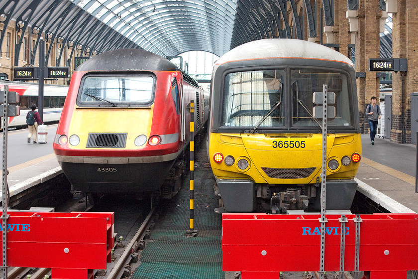 43305, GR 17.00 London Kings Cross-Edinburgh (1S26) & 365505, GN 16.22 London Kings Cross-Peterborough (1P60), London Kings Cross station 
 43305 sits on the blocks at King's Cross being prepared to work the 1S26 17.00 to Edinburgh. Next it, 365505 will work the 16.22 to Peterborough. Looking at the station clocks, it is already two minutes late! 
 Keywords: 43305 17.00 London Kings Cross-Edinburgh 1S26 365505 GN 16.22 London Kings Cross-Peterborough 1P60 London Kings Cross station